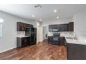 Well-equipped kitchen with stainless steel appliances, dark cabinetry, and light countertops at 141 Sandestin Dr, Haines City, FL 33844
