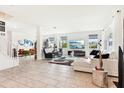 Spacious living room with tile floors, neutral decor, lots of natural light, and open-concept design at 2215 Upland Ln, Apopka, FL 32712