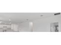 Open-concept living space connects to the kitchen, with recessed lighting and neutral paint at 2533 Raghav Trl, Tavares, FL 32778