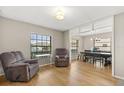 Bright and airy living room featuring hardwood floors and comfortable seating, creating a welcoming atmosphere at 359 Westwind Ct, Lake Mary, FL 32746
