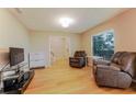 Bright living room with wood floors, comfortable seating, and lots of natural light at 359 Westwind Ct, Lake Mary, FL 32746