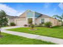 Well-manicured lawn complements this inviting home with a two car garage at 4444 Quartz Ct, Lakeland, FL 33811
