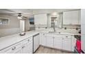 Open kitchen layout with new appliances, quartz countertops and wood flooring at 5436 Tangerine Ave, Winter Park, FL 32792
