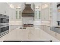 Bright kitchen showcases a spacious island with a marble countertop, perfect for food preparation and entertaining at 6233 Rydal Ct, Windermere, FL 34786