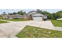 Charming single-Gathering home featuring a well-maintained lawn and attached two-car garage at 7243 Minippi Dr, Orlando, FL 32818