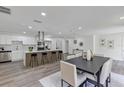 Bright open kitchen with island, stainless appliances, a modern range hood, and lots of cabinets at 822 Glen Arden Way, Altamonte Springs, FL 32701