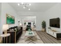 Modern living room boasts stylish decor, a comfortable seating area, and seamless access to other areas at 8812 Oakwood Dr, Lake Wales, FL 33898