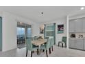 Inviting dining area featuring an elegant table set, stylish chairs and sliding glass door at 9239 Sommerset Hills Dr, Davenport, FL 33896