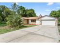 Charming single-story home with a stone accent exterior and a well-manicured lawn at 111 Main St, Windermere, FL 34786