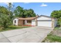 Charming single-story home with a stone accent exterior and a well-manicured lawn at 111 Main St, Windermere, FL 34786