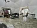 Spacious living room with unique dome ceiling, skylight, and modern decor at 1292 Nadine Dr, Deltona, FL 32738