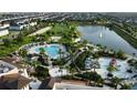 A high angle aerial view of the community's pool, lake, and recreational areas at 1544 Nassau Point Trl, Kissimmee, FL 34747