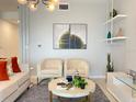 Bright living room boasts modern furniture and art with stylish decor accents at 3191 Paradox Cir # 102, Kissimmee, FL 34746