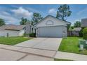 Exterior view showing a home with a two car garage and well maintained yard at 478 N Sundance Dr, Lake Mary, FL 32746