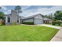 Well maintained home with stone accents, large front lawn and 2 car garage at 478 N Sundance Dr, Lake Mary, FL 32746