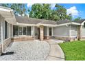 Close-up view of home entrance with stone accents and a welcoming walkway at 679 N Endeavour Dr, Winter Springs, FL 32708
