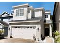 Charming two-story home with a well-manicured lawn, a two car garage, and beautiful stone walkway at 932 S Lake Sterling Ct, Casselberry, FL 32707