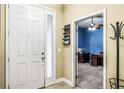 Welcoming foyer with tiled flooring and view into a carpeted office space at 969 Springs Landing Dr, Deltona, FL 32725