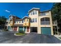 Inviting townhouse complex with well-maintained grounds, garages, and charming exterior details at 12106 Poppy Field Ln # 107, Orlando, FL 32837