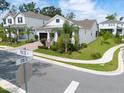 Beautiful single-Gathering home with a brick driveway, lush landscaping, and a welcoming front porch in a desirable neighborhood at 1382 Foltz Loop, Oakland, FL 34787