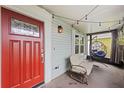 Inviting front porch with hanging chair and string lights, perfect for relaxing outdoors at 1413 Brookebridge Dr, Orlando, FL 32825