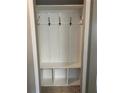Well-organized mudroom area with hooks and shelving for convenient storage at 1413 Brookebridge Dr, Orlando, FL 32825