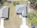 An aerial view of a single-Gathering home showcasing the roof and driveway at 14930 Sw 66Th Ave Rd, Ocala, FL 34473