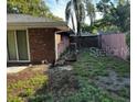 Fenced backyard with partial grass coverage provides a private outdoor space at 1511 Hobson St, Longwood, FL 32750