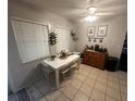 Bright dining area featuring tile floors, a dining table, and a stylish sideboard at 1511 Hobson St, Longwood, FL 32750