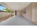 Spacious carport area with painted concrete floor, providing covered parking and access to the home at 1533 Fort Smith Blvd, Deltona, FL 32725