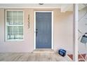 Close-up of front door with address numbers, modern hardware, and a welcoming entrance at 1533 Fort Smith Blvd, Deltona, FL 32725