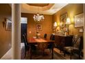 Formal dining room featuring a chandelier, elegant furnishings, and ample space for entertaining guests at 2237 Osprey Woods Cir, Orlando, FL 32820