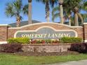Attractive brick community sign for Somerset Landing with colorful landscaping at 2451 Strandhill St, Orlando, FL 32824