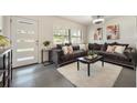 Comfortable living room with natural light, a cozy couch, and modern decor at 2603 E Marks St, Orlando, FL 32803