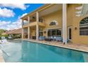 A large inground pool is surrounded by comfortable patio furniture and offers a relaxing outdoor retreat at 283 Lakay Pl, Longwood, FL 32779