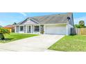 Wide driveway leading to a two-car garage in this well-maintained home at 3038 Golden Rock Dr, Orlando, FL 32818