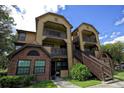 Attractive condo building with dual balconies, and brick facade at 380 Lake Ontario Ct # 304, Altamonte Springs, FL 32701