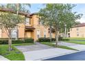 Inviting two-story townhome with lush landscaping and private entrances at 412 Verona Ave, Davenport, FL 33897