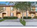 Charming townhouse featuring a well-maintained lawn and private entryway at 412 Verona Ave, Davenport, FL 33897