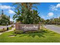 The brick College Park welcome sign surrounded by lush landscaping at 523 W Princeton St # 1, Orlando, FL 32804