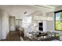 Modern kitchen with a marble island, stainless steel appliances, and an elegant hanging light fixture at 523 W Princeton St # 1, Orlando, FL 32804