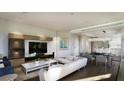 Open-concept living area with hardwood floors, modern furnishings, and a stylish lighting fixture at 523 W Princeton St # 1, Orlando, FL 32804