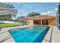 Relaxing screened-in pool area perfect for entertaining and enjoying the beautiful backyard view at 604 Cheviot Ct, Apopka, FL 32712