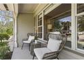 Relaxing front porch with stylish seating, perfect for enjoying the outdoors at 676 Dunblane Dr, Winter Park, FL 32792