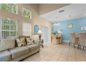 Open concept living and dining area boasts lots of natural light, neutral walls and stylish furnishings at 8507 Crystal Cove Loop, Kissimmee, FL 34747