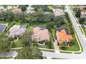 Expansive aerial shot of the property, showcasing the meticulously landscaped yard and neighboring homes at 8531 Cypress Hollow Ct, Sanford, FL 32771