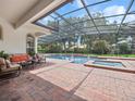 Relaxing backyard pool with a screened-in patio, perfect for outdoor enjoyment at 8531 Cypress Hollow Ct, Sanford, FL 32771