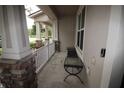 Cozy front porch with outdoor seating, perfect for relaxing and enjoying the neighborhood view at 8670 Vedder Ln, Orlando, FL 32832