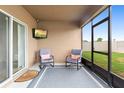 Cozy screened-in patio with comfortable seating and a mounted television at 927 Denali Dr, Orange City, FL 32763