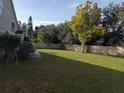 Expansive backyard featuring lush lawn space, mature trees, and a privacy fence at 13200 Mallard Cove Blvd, Orlando, FL 32837